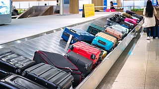 Bijbetalen voor koffer: waar moet je op letten?