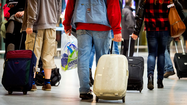 Reizigers zonder handbagage krijgen voorrang op Schiphol
